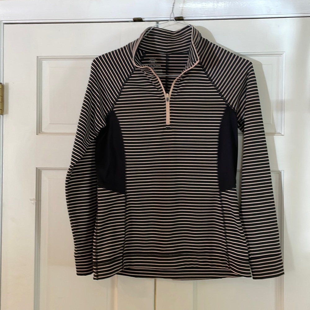 Nice pullover with zipper. Tailored and neat. Sides have ribbed fabric.